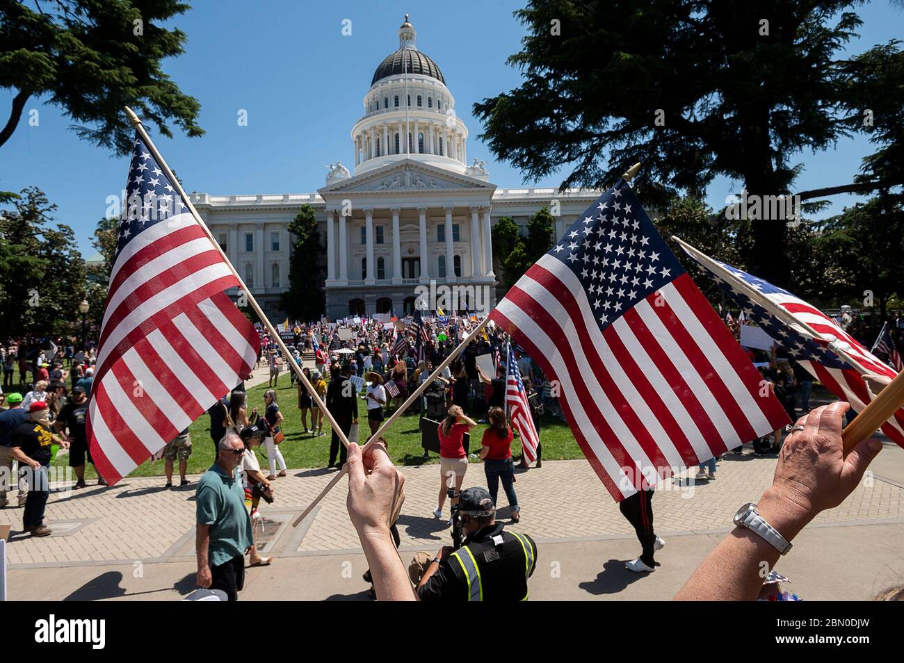 Sacramento, California, USA. 1st May, 2020. Protesters demonstrate at the Capitol in Sacramento against California Gov. Gavin Newsom's stay-at-home order intended to slow the spread of the coronavirus. Credit: Paul Kitagaki Jr/Sacramento Bee/ZUMA Wire/Alamy Live News Stock Photo