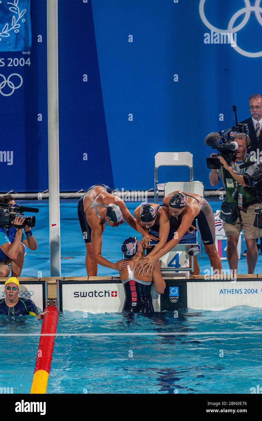 Team USA -Natalie Coughlin, Carly Piper  Dana Vollmer, Kaitlin Sandeno  wins the gold medal in the Women's 4 × 200 metre freestyle relay at the 2004 O Stock Photo