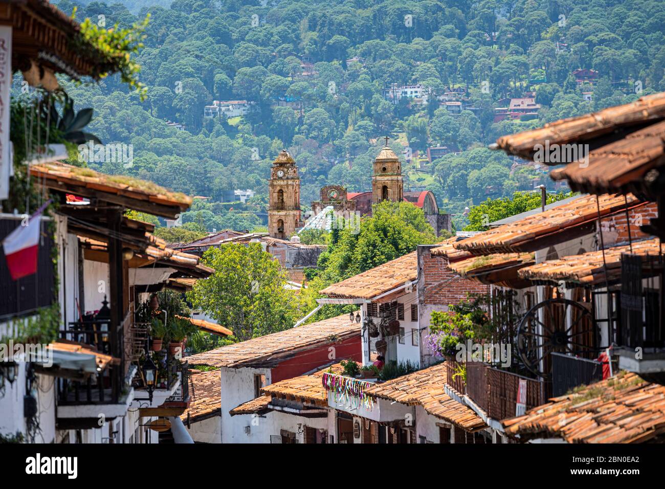Temple of Santa Maria  Ahuacatlan and tiled roof houses in Valle de Bravo in the state of Mexico, Mexico. Stock Photo