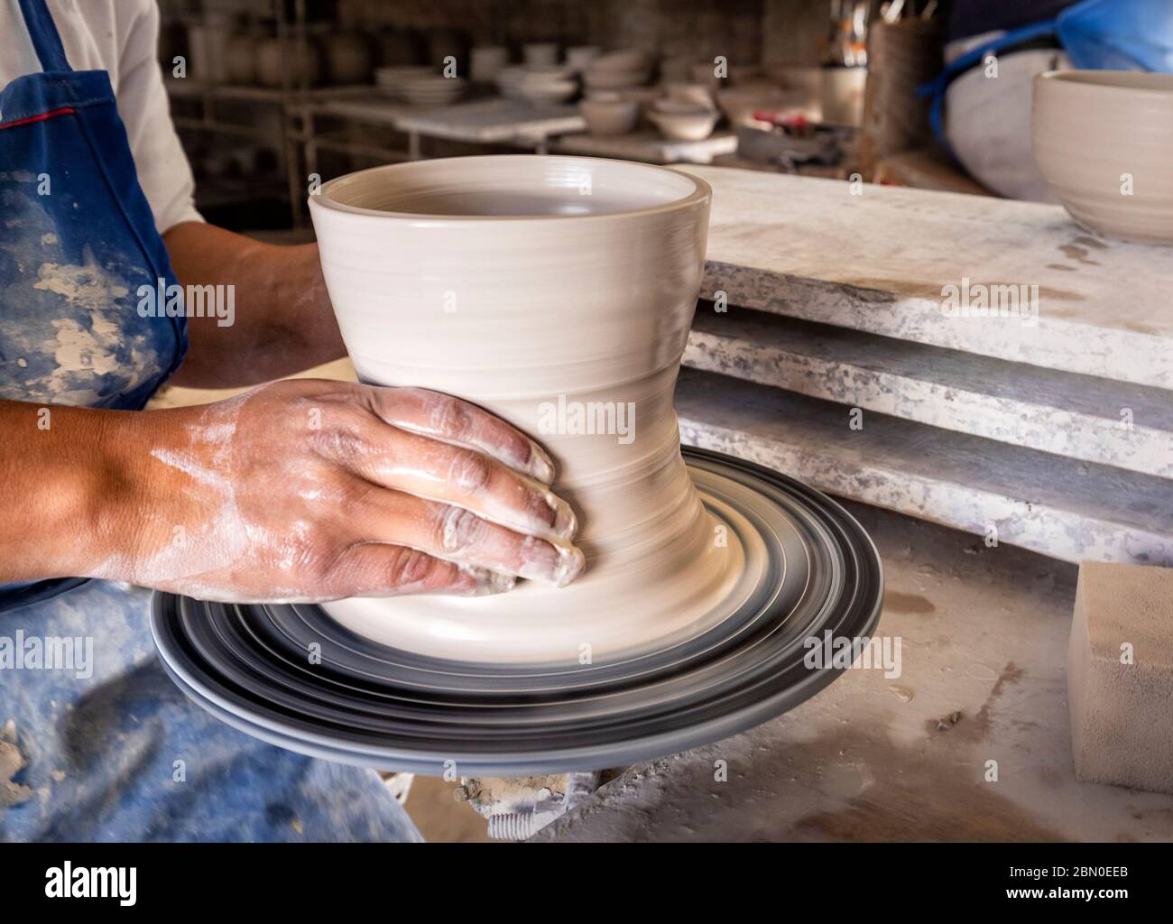 An artisan molds clay bowls in Valle de Bravo in the state of Mexico, Mexico. Stock Photo