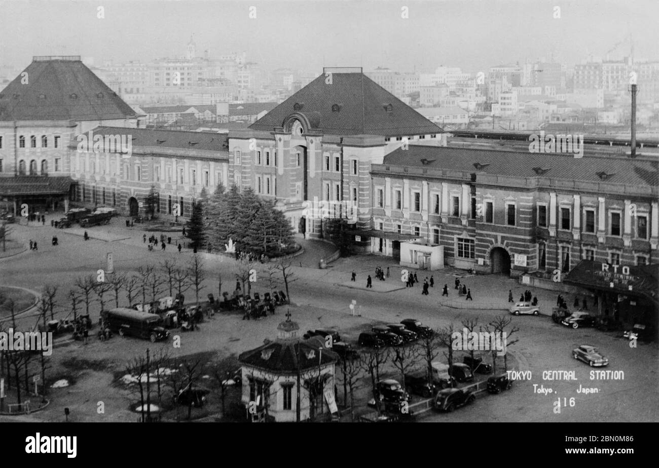[ 1940s Japan - Tokyo Station ] —   The early post-war Tokyo Station, located in the Marunouchi business district of Tokyo, in the late 1940s.  This photo shows the station without the third floor and the domes, which were destroyed during the firebombings of 1945 (Showa 20).  20th century vintage postcard. Stock Photo