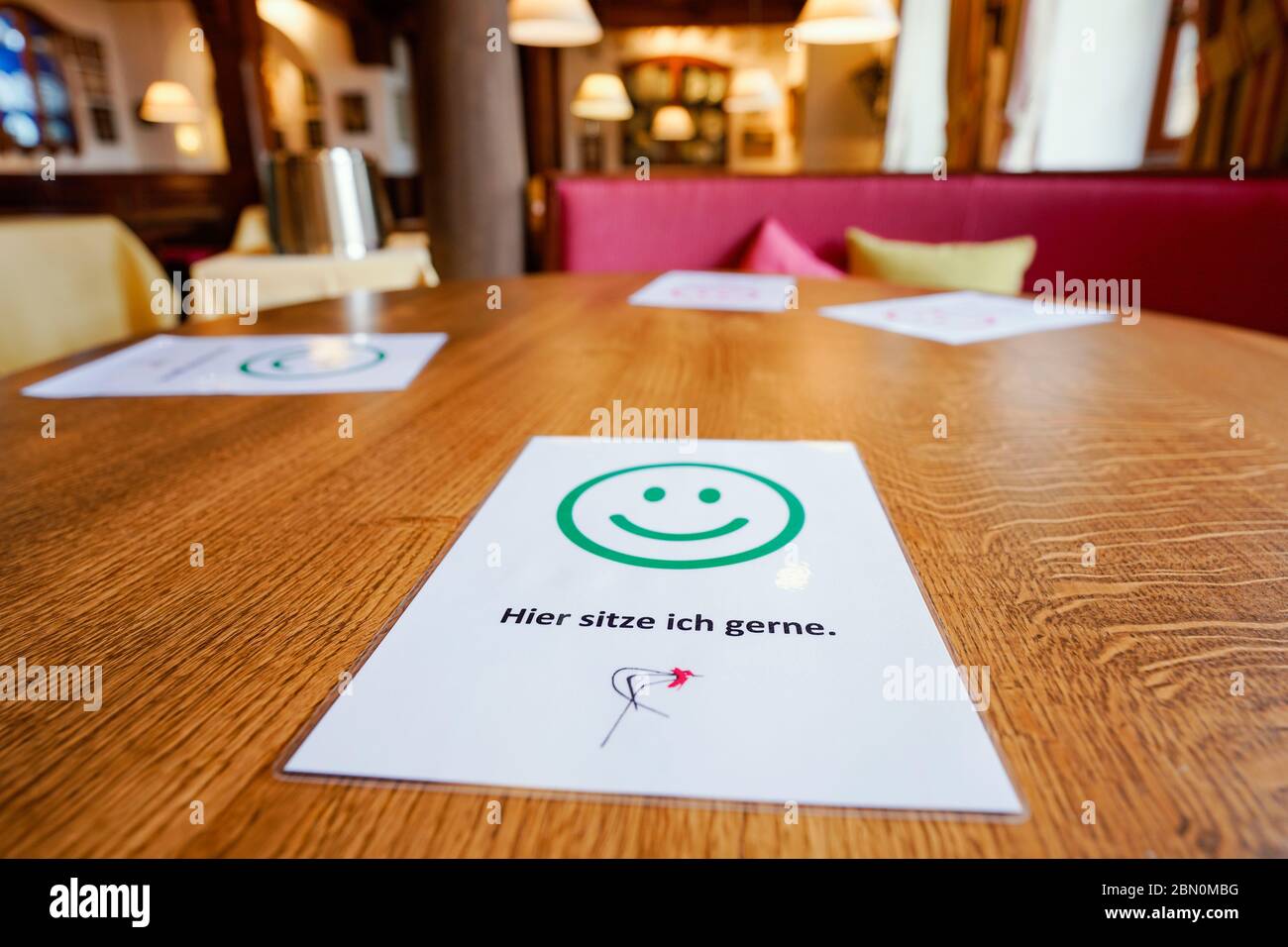 Deidesheim, Germany. 09th May, 2020. Information leaflets for the correct safety distance according to Corona rules are on a table in the restaurant and hotel 'Deidesheimer Hof'. (to dpa 'Partition walls and flutter band - restaurants and pubs in starting blocks') Credit: Uwe Anspach/dpa/Alamy Live News Stock Photo
