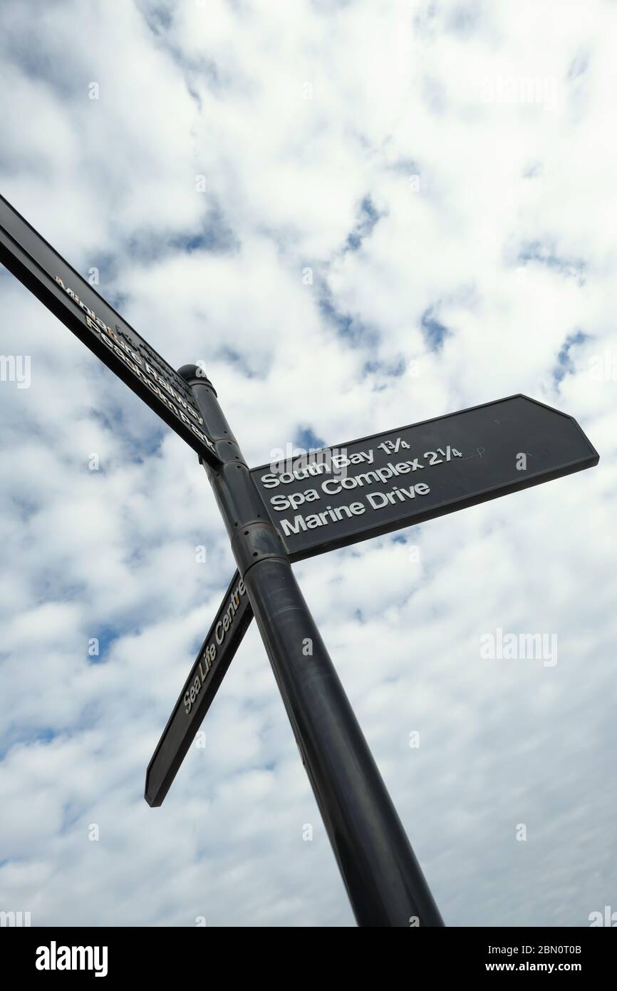 Signpost showing various destinations in Scarborough Yorkshire England UK Stock Photo