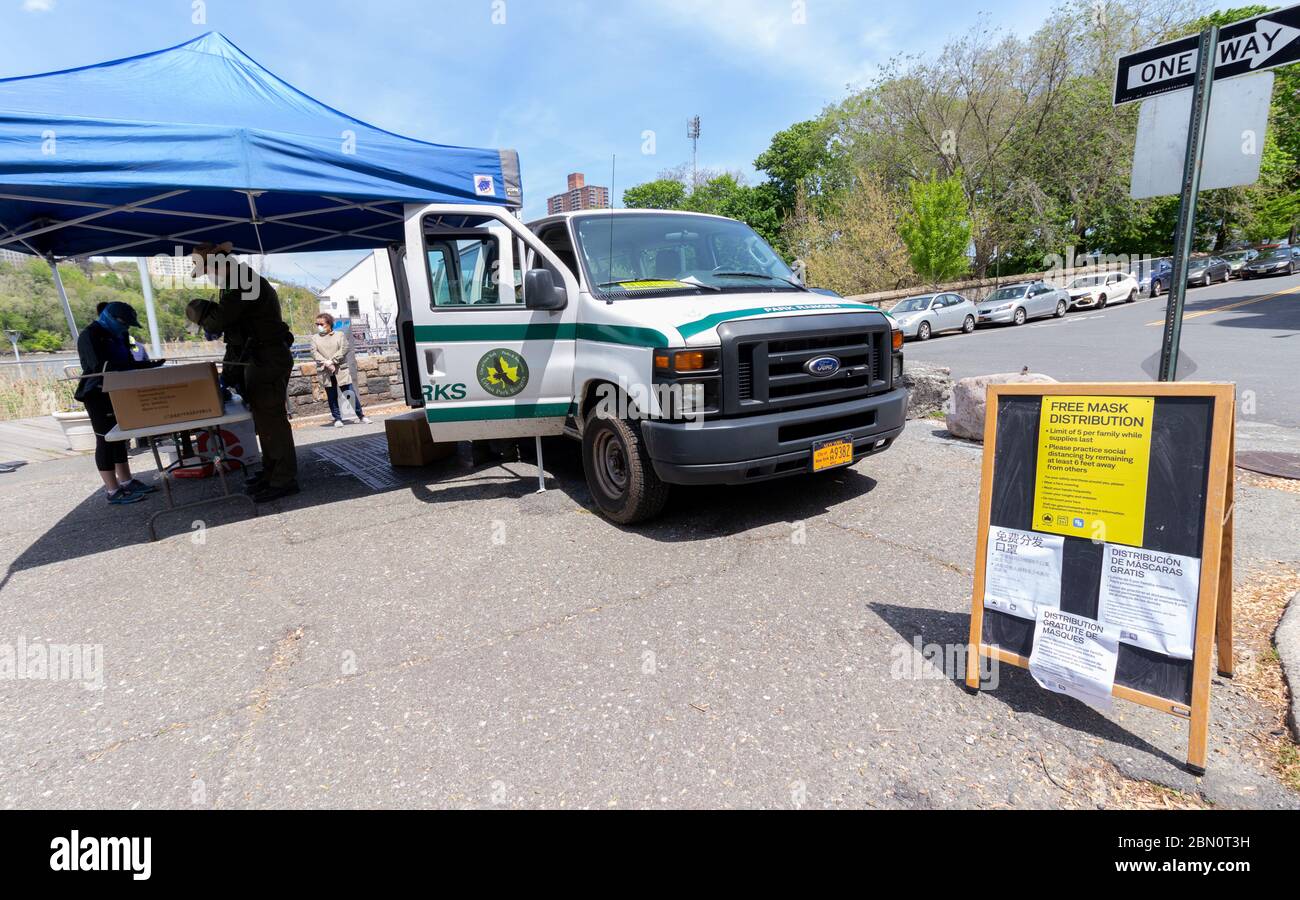 NYC Department of Parks and Recreation station in Inwood Hill Park set up to distribute free face masks during the coronavirus or covid-19 pandemic Stock Photo
