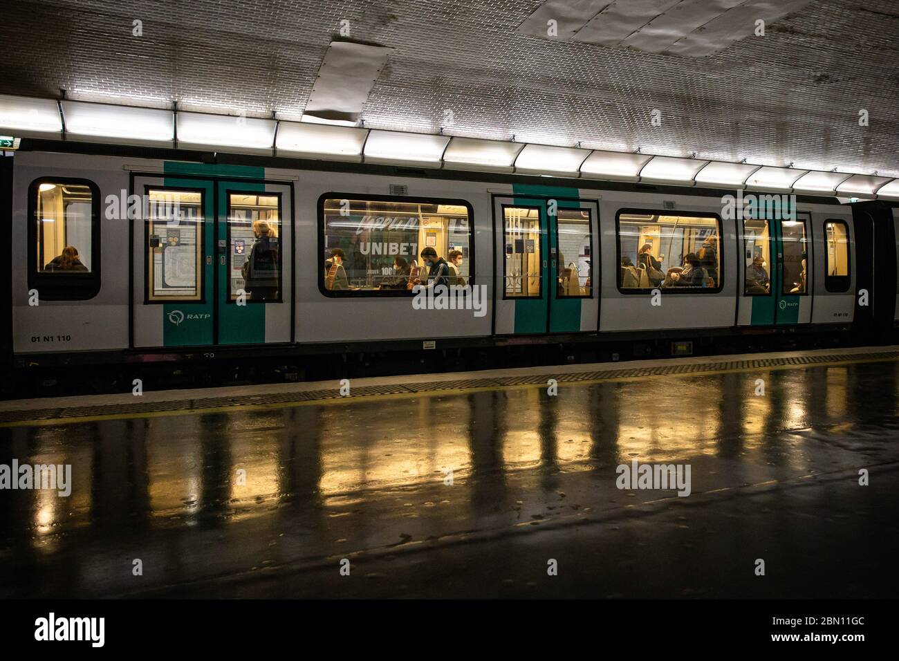Paris, France. 11th May, 2020. Commuters ride a subway in Paris, France, on May 11, 2020. France on Monday cautiously started a gradual process to return to normalcy, easing some restrictions while maintaining others to avoid a new epidemic wave. Credit: Aurelien Morissard/Xinhua/Alamy Live News Stock Photo