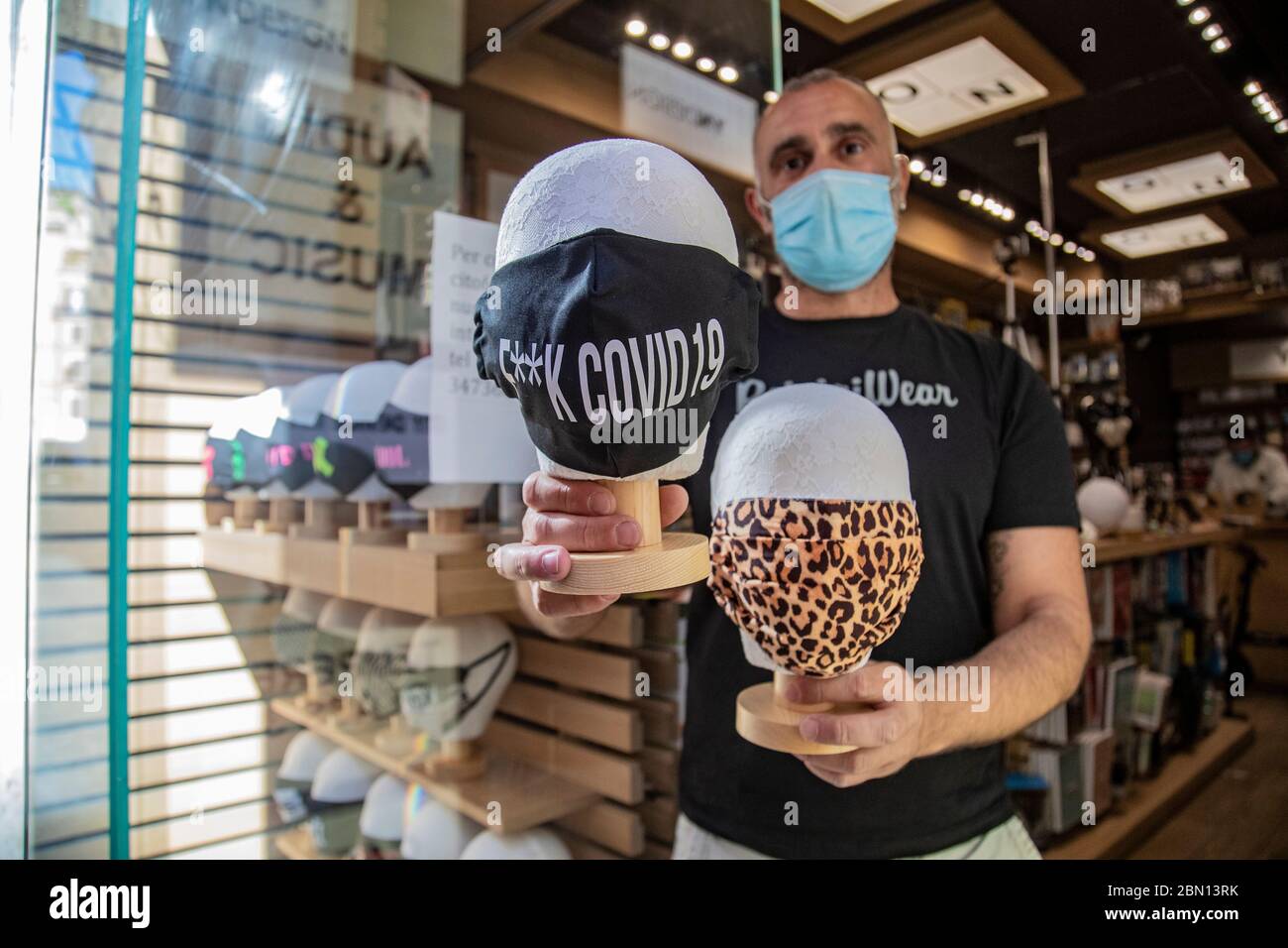 Rome, Italy. 11th May, 2020. A shop in via Frattina (Rome) sell a custom protective masks during the phase two of the Coronavirus Covid-19 emergency. (Photo by Davide Fracassi/Pacific Press) Credit: Pacific Press Agency/Alamy Live News Stock Photo