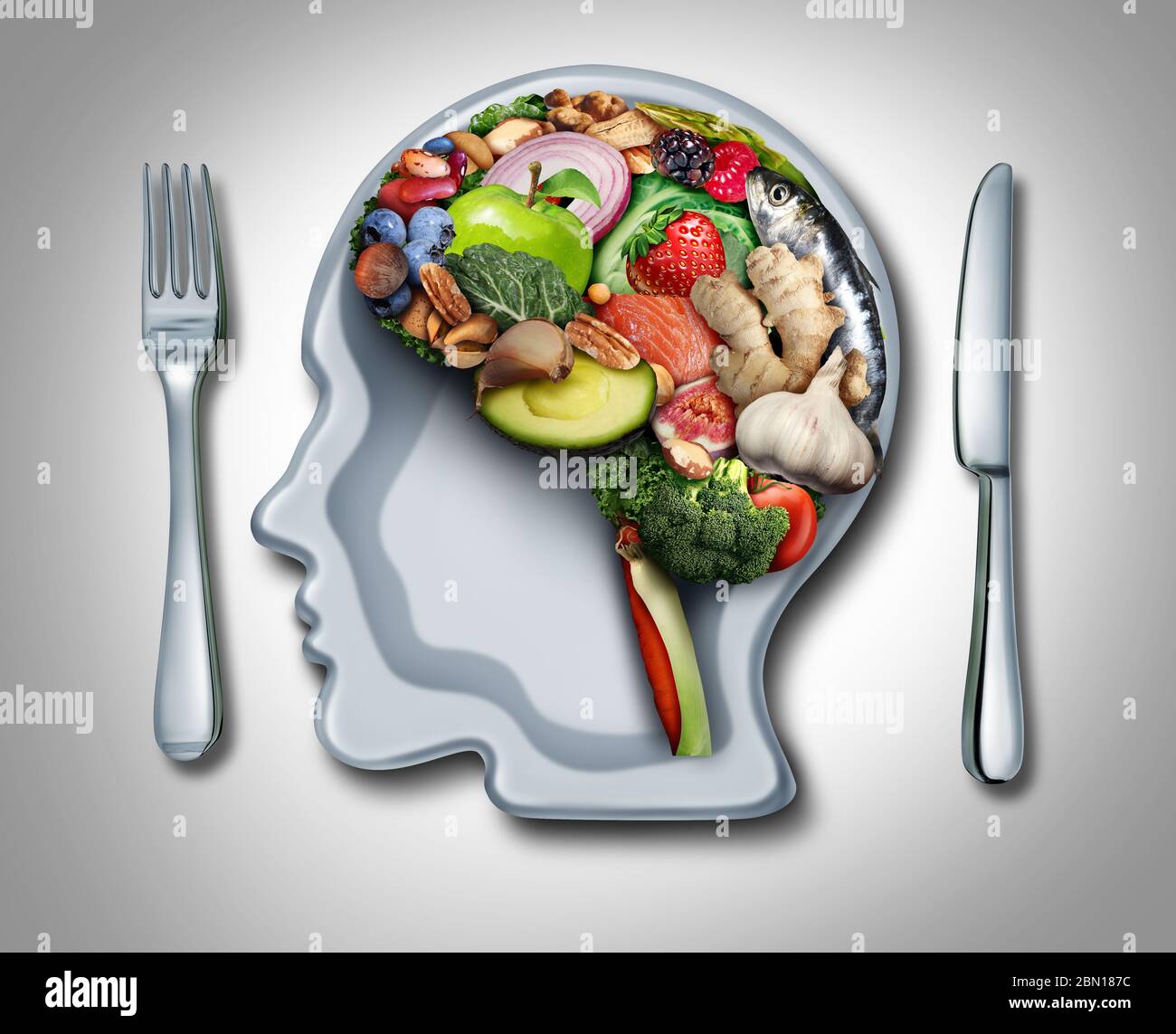 Brain diet and food psychology or nutritional psychiatry as healthy food shaped as a thinking organ with a plate in the shape of a human head. Stock Photo