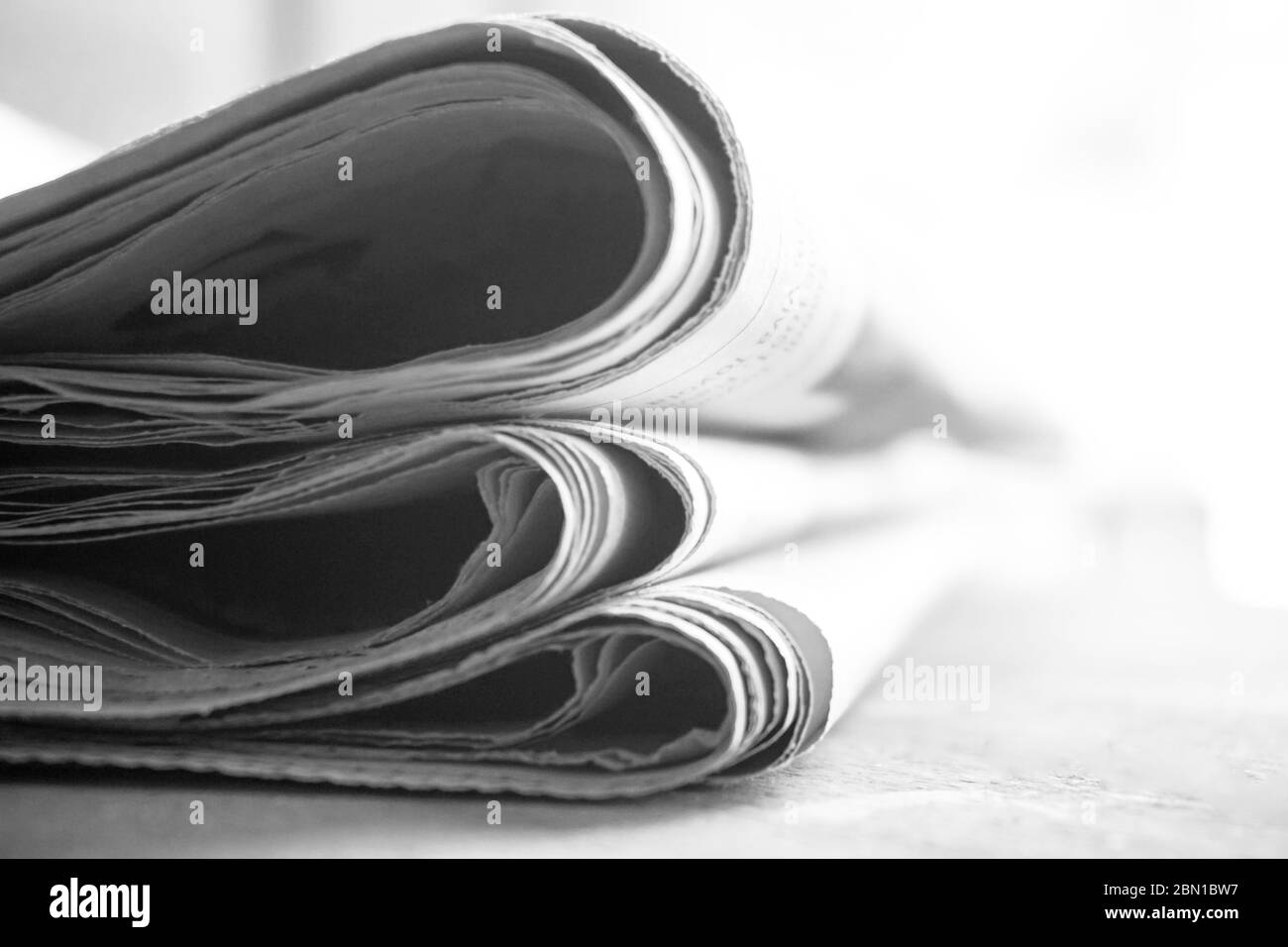 rolled up newspaper stack background Stock Photo