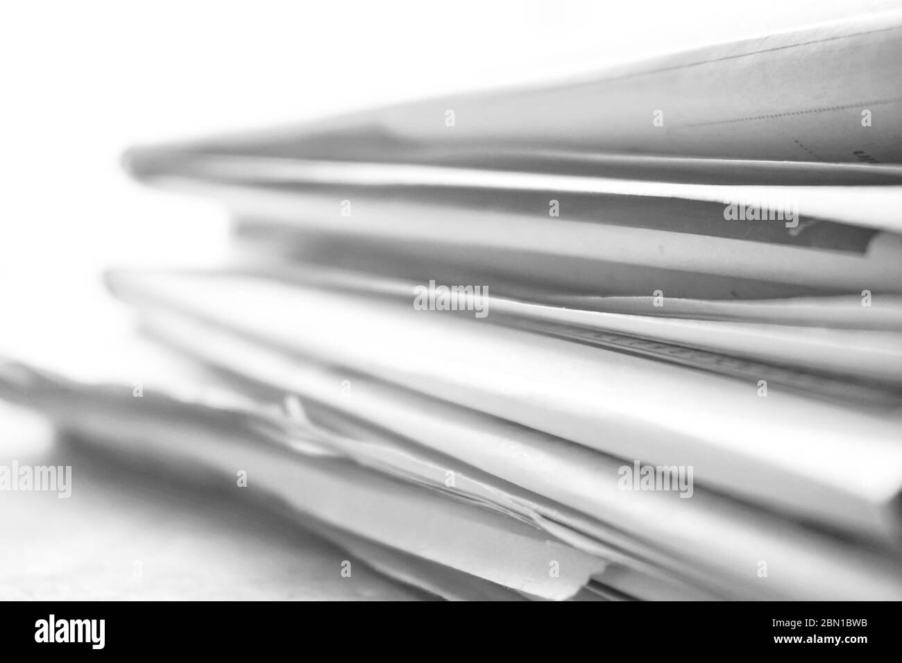 rolled up newspaper stack background Stock Photo