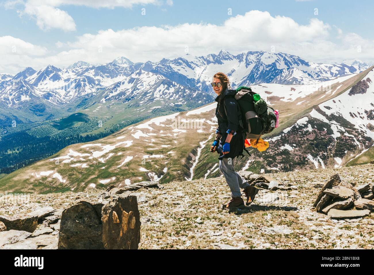 Woman hiking to the top of a mountain hi-res stock photography and ...