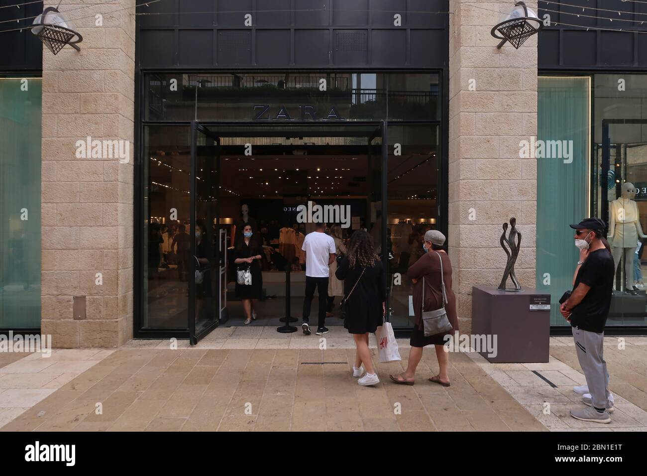 Israelis entering Zara clothing store as Israel eases Coronavirus  restrictions in Mamilla Mall, also known as Alrov Mamilla Avenue a shopping  street and the only open-air mall near the old city in