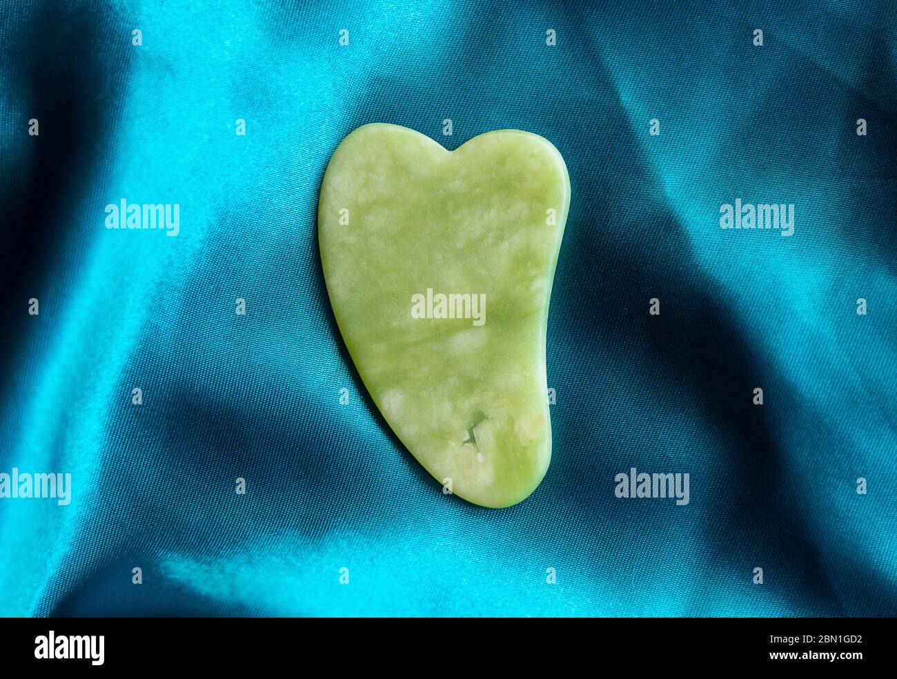 gua sha tool in natural gemstones of Green Jade Stock Photo Alamy