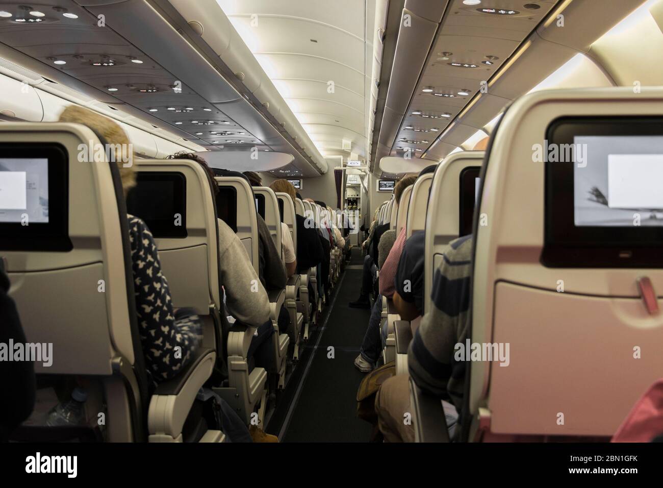Sitting on the plane. View into the aisle. Seats and people Stock Photo Alamy