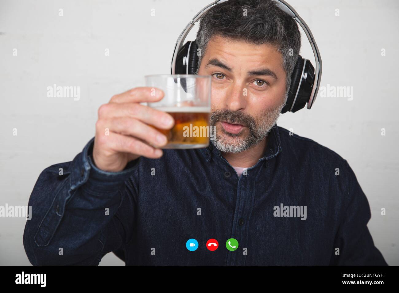 Man Chatting On A Video Call Person Sharing A Glass Of Beer On A Tech Platform During Quarantine Isolation Stock Photo Alamy
