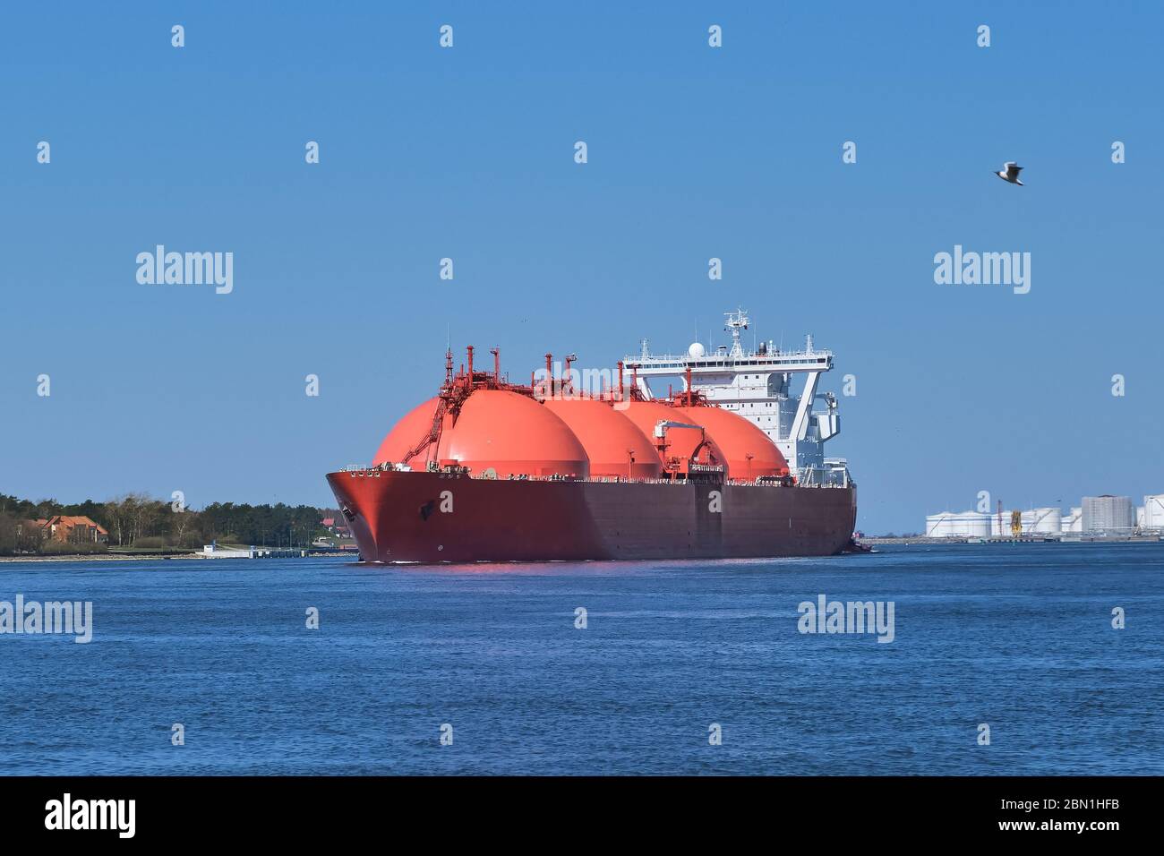 LNG or liquified natural gas tanker enter port on a sunny day in Klaipeda, Lithuania. Alternative gas supply, commercial freight, energy crisis Stock Photo