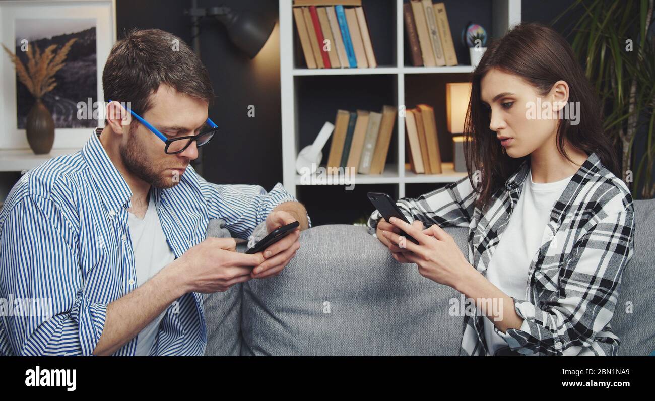 Couple using their cellphones Stock Photo