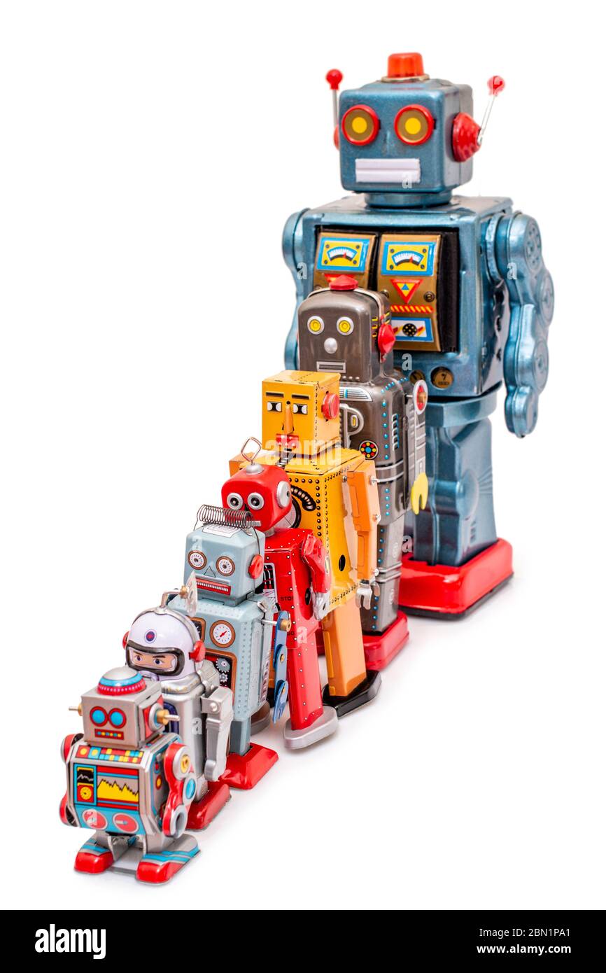 Close up view of colorful mixed vintage tin robot toys collection from small to big. Stock Photo