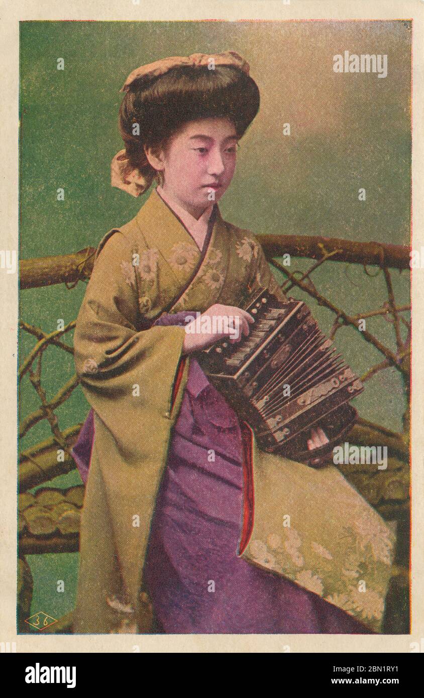 [ 1910s Japan - Portrait of the Geisha Teruha ] —   The famed geisha Teruha (照葉). Born in Nara in 1896 (Meiji 29) as Tatsuko Takaoka (高岡たつ子), her father sold her to a geisha house when she was 12. She soon became known as Chiyoha (千代葉).  Around 16, she cut off her little finger because of a broken heart. She recovered and changed her name to Teruha.   20th century vintage postcard. Stock Photo