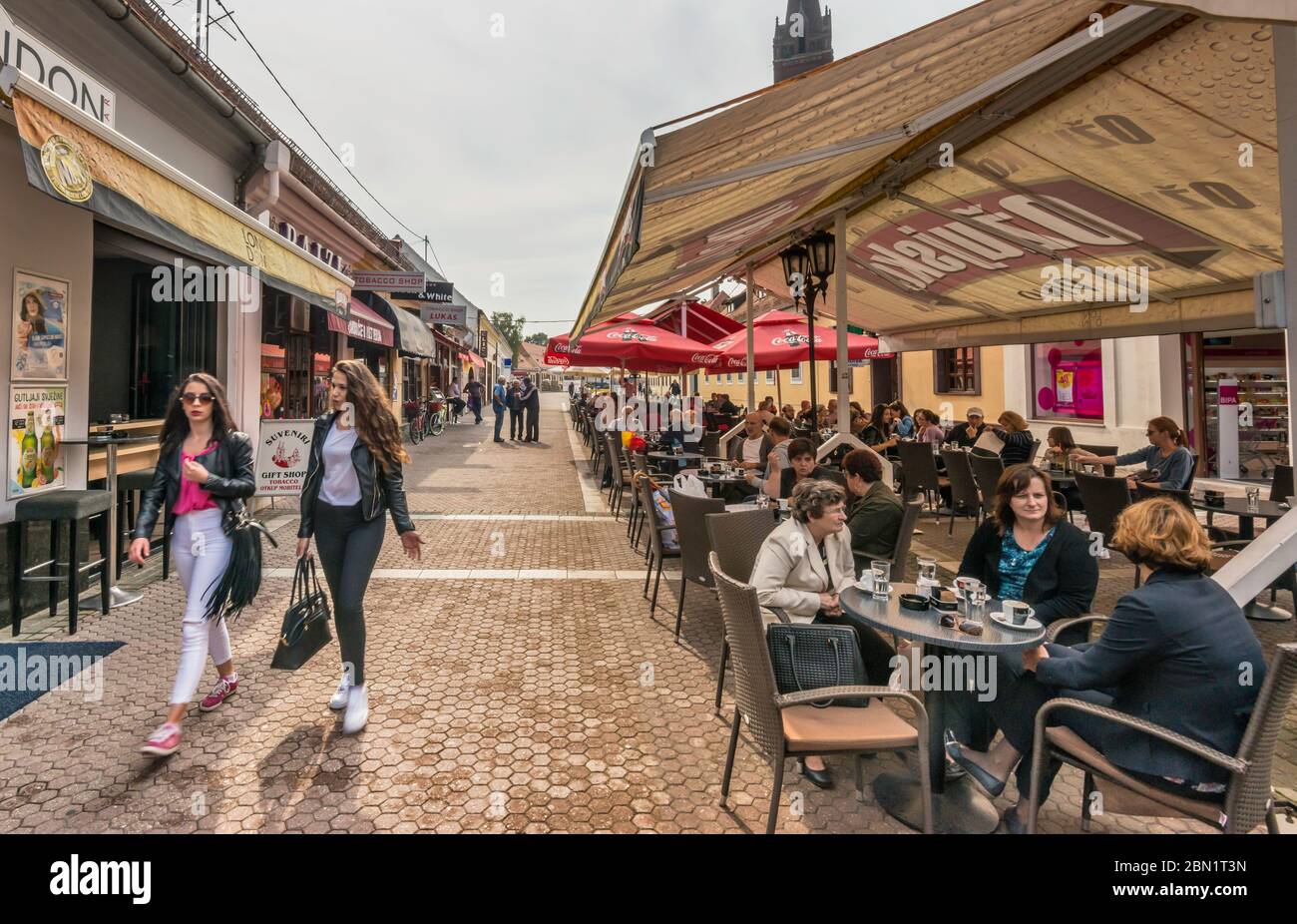 Sidewalk cafes at ulica Ivana Pavla II (John Paul 2nd Street), pedestrian area in Dakovo, Slavonia, Croatia Stock Photo