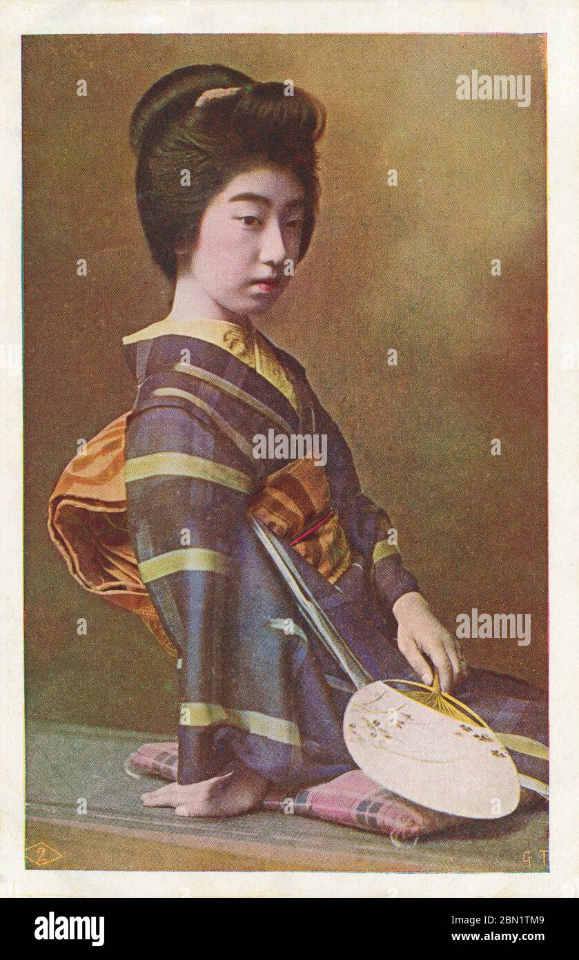 [ 1910s Japan - Portrait of the Geisha Teruha ] —   The famed geisha Teruha (照葉). Born in Nara in 1896 (Meiji 29) as Tatsuko Takaoka (高岡たつ子), her father sold her to a geisha house when she was 12. She soon became known as Chiyoha (千代葉).  Around 16, she cut off her little finger because of a broken heart. She recovered and changed her name to Teruha.  20th century vintage postcard. Stock Photo