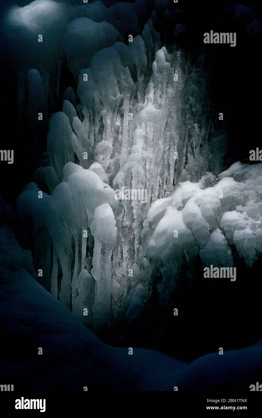 Vertical shot of Ice waterfall in Auvergne-Rhone-Alpes, France Stock Photo