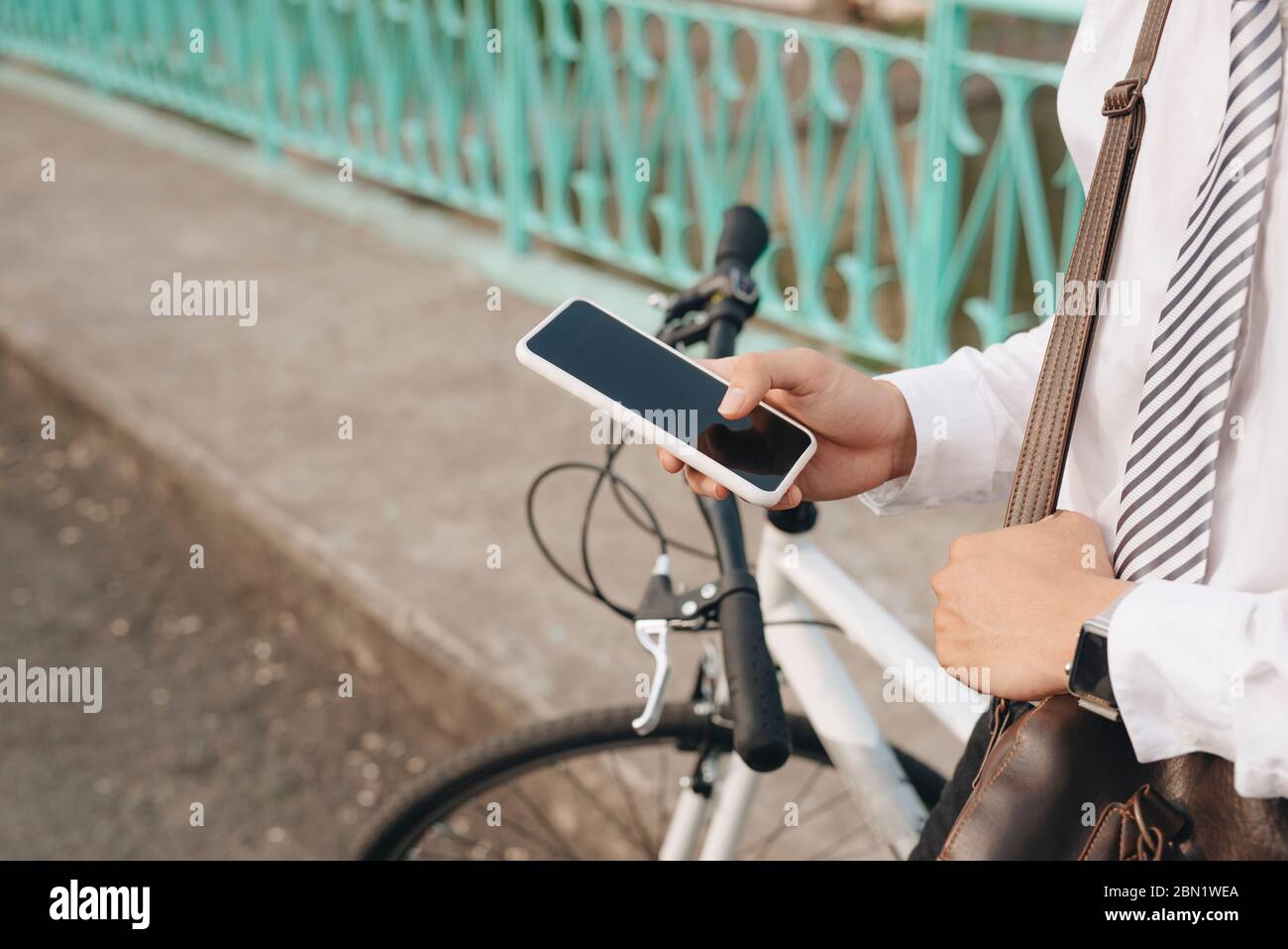 Using mobile phone riding a bike hi-res stock photography and images ...