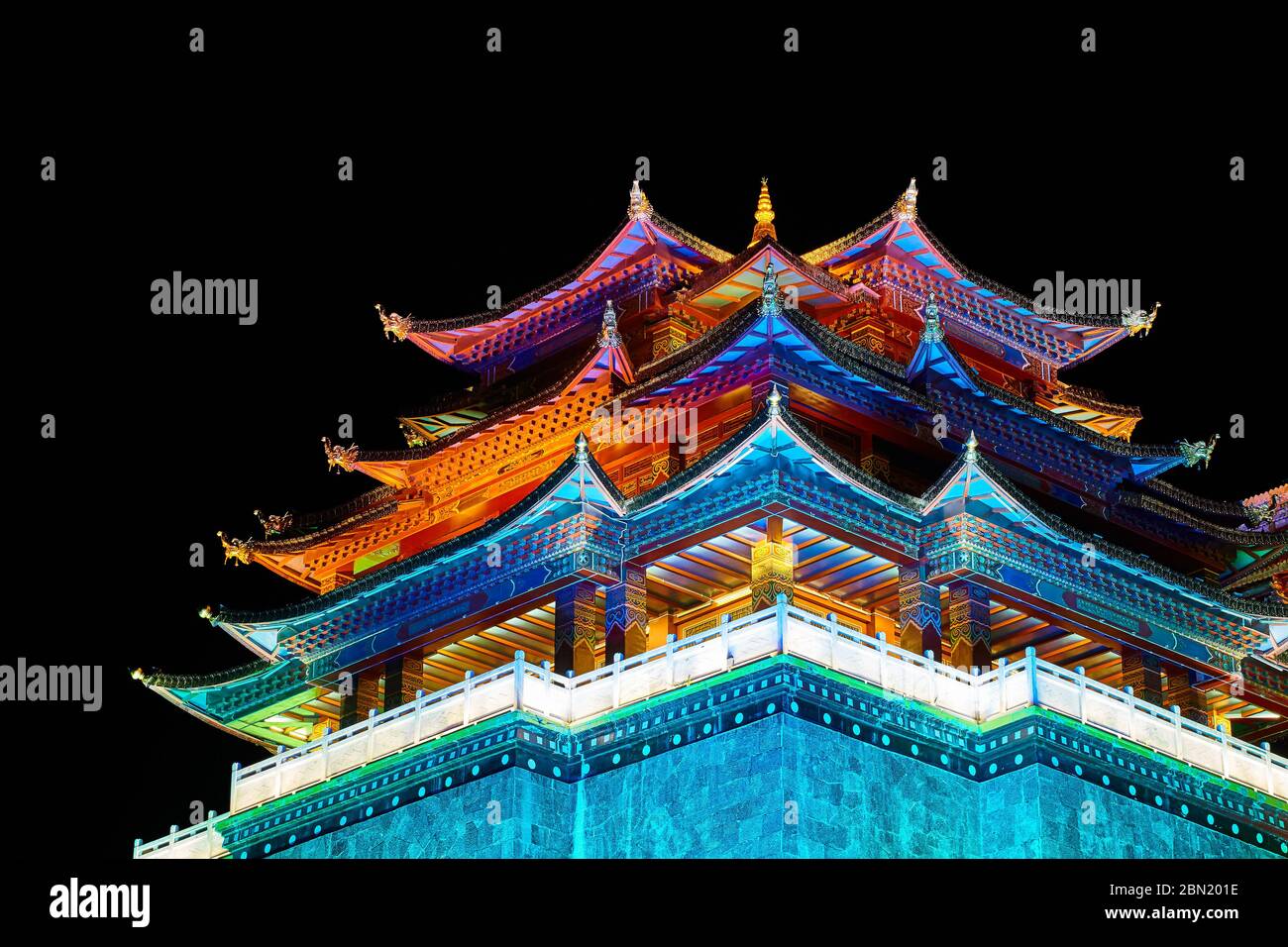 Illuminated Guishan Temple of Tibetan Buddhism at night, Shangri La, China. Stock Photo