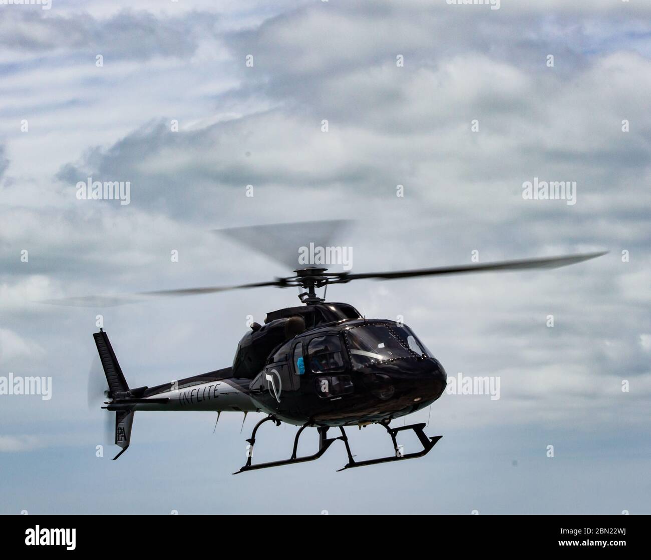 Helicopter approaching to land Stock Photo