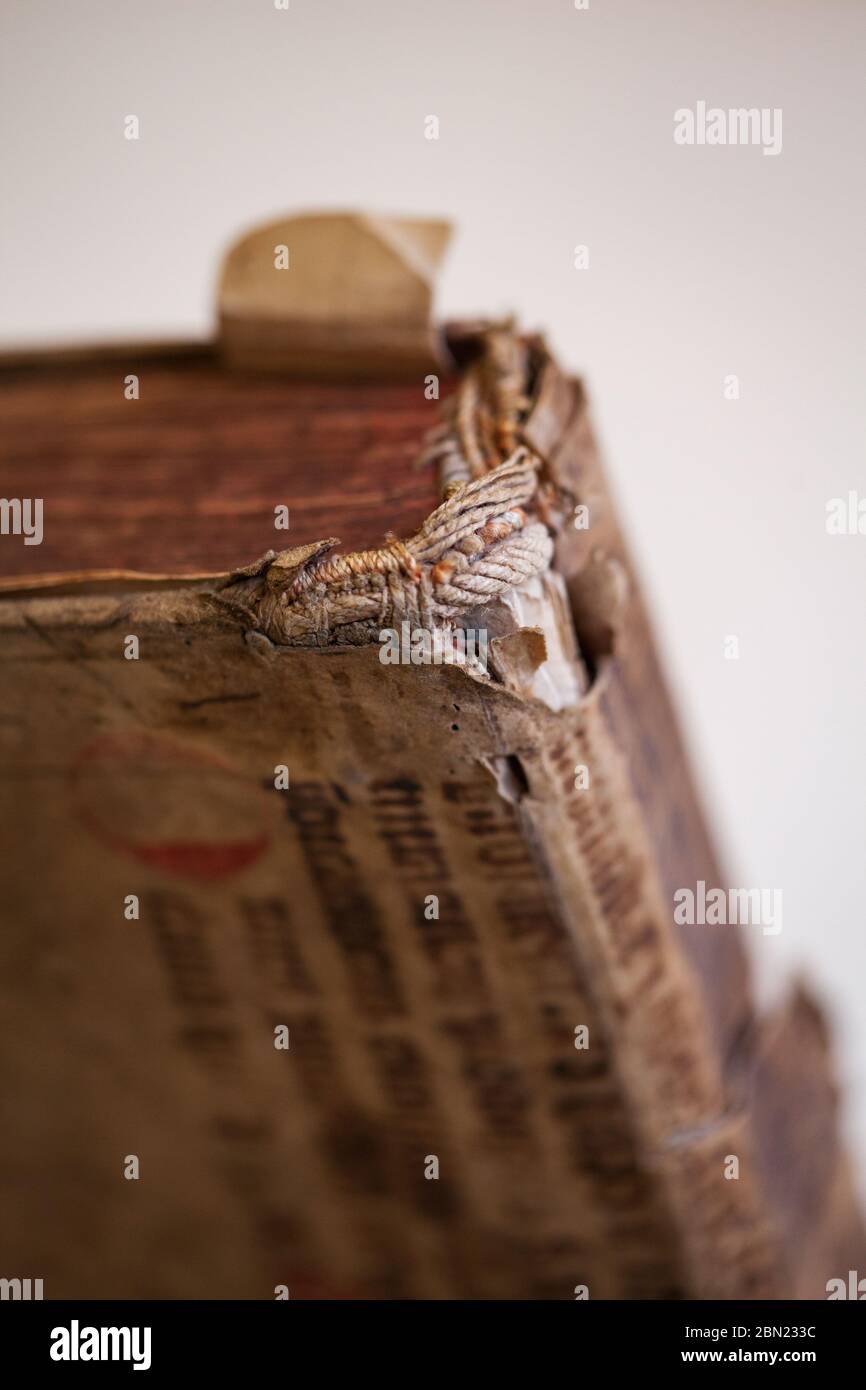 Old tattered book. Sheets of an old thick book. The old pages are