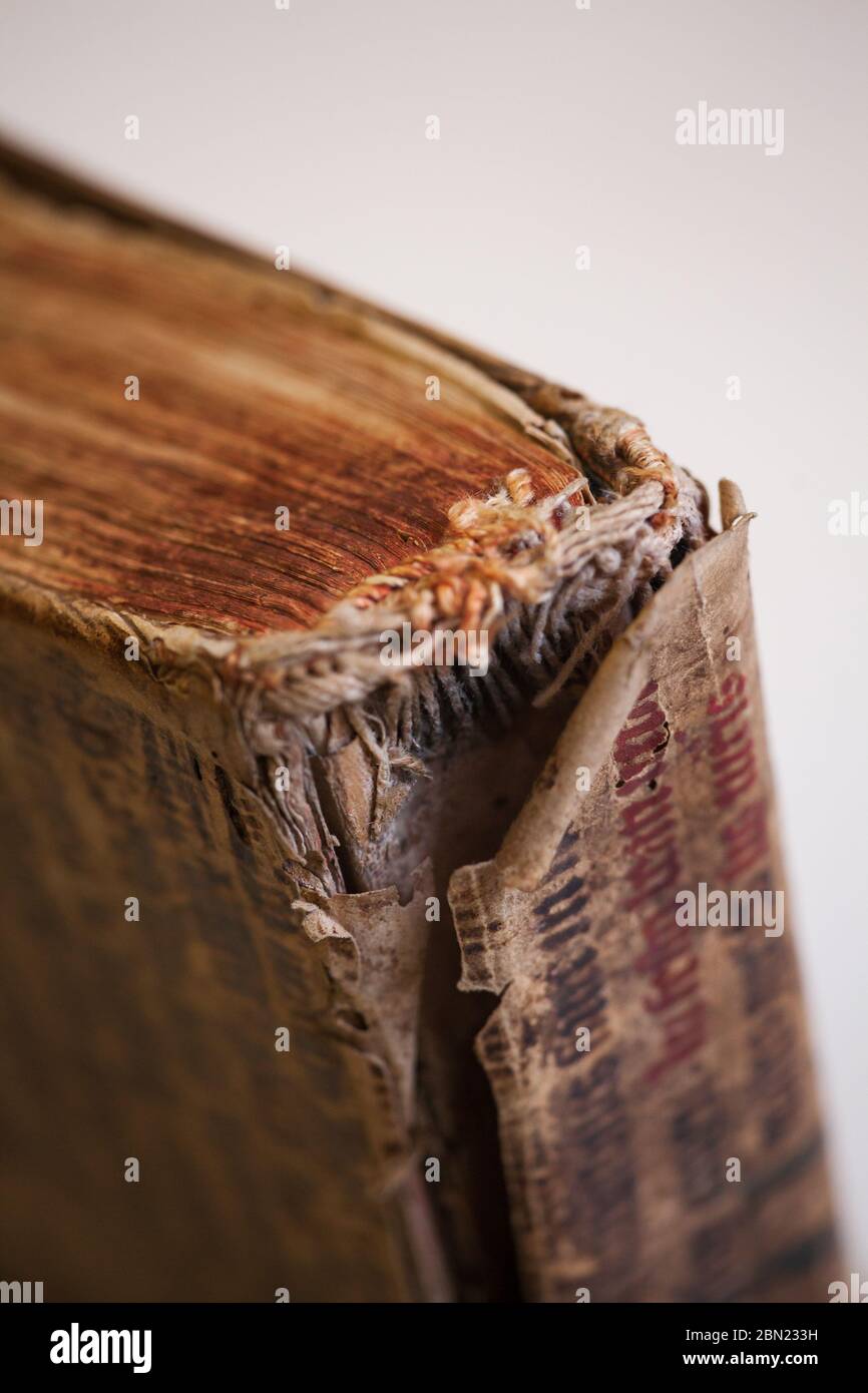 Old tattered book. Sheets of an old thick book. The old pages are