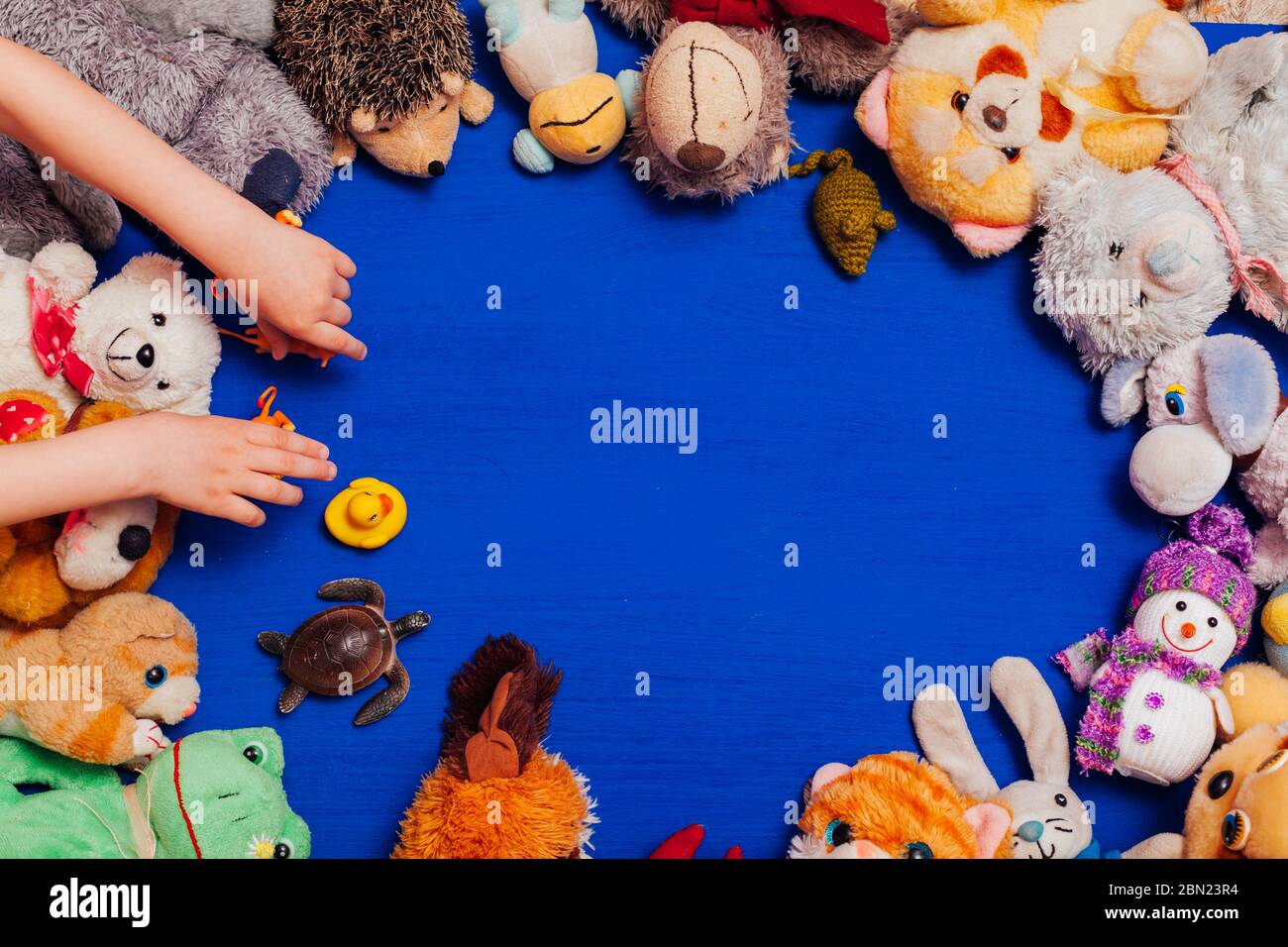 children's soft toys for developing baby games on a blue background