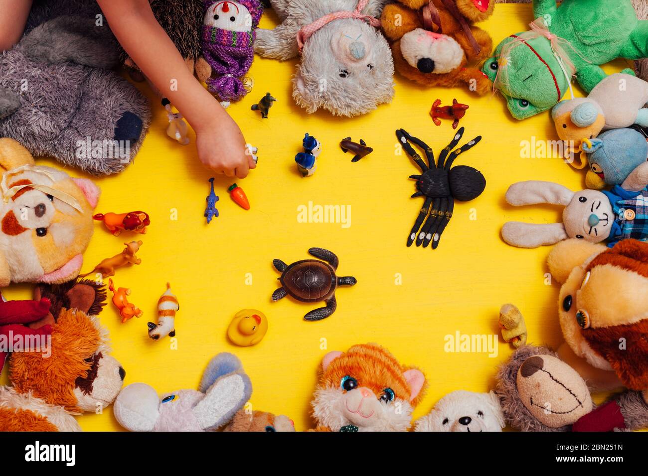 Children's soft toys for developing baby games on a yellow background