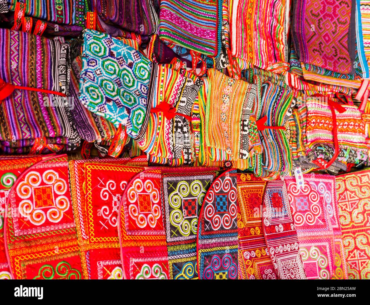 Display of multicolored ethnic fabrics with geometric shapes, Can Cau market, Vietnam Stock Photo