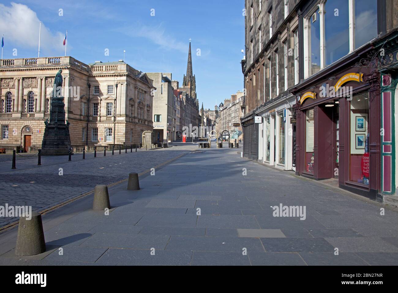 Edinburgh city centre, Scotland, UK. 12th May 2020. Fiftieth day of UK Covid-19 Coronavirus Lockdown, streets and pavements pictured show a touristless city with very little traffic or pedestrians out and about before 9.45am. Pictured the view fromThe Royal Mile up towards The Lawnmarket. Many boarded up pubs which are not expected to open in Scotland until perhaps July. Credit: Arch White/Alamy Live News. Stock Photo