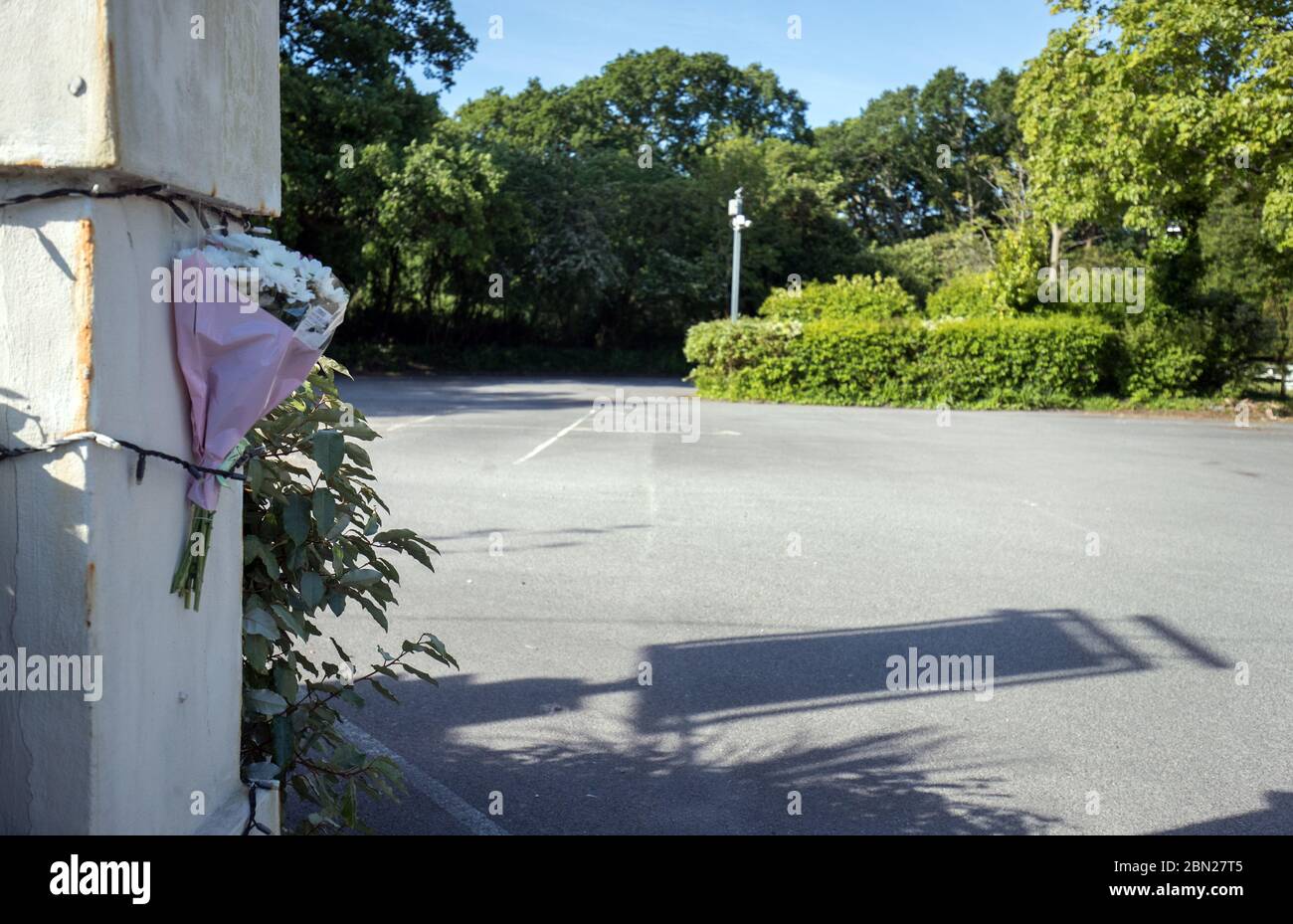 Flowers left at the car park of the Horns Inn in West Parley, near