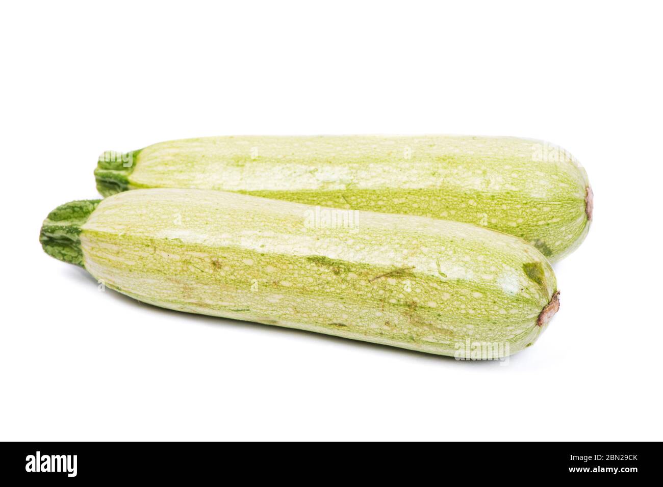 Two fresh vegetable marrows. Zucchini Isolated on white background Stock Photo