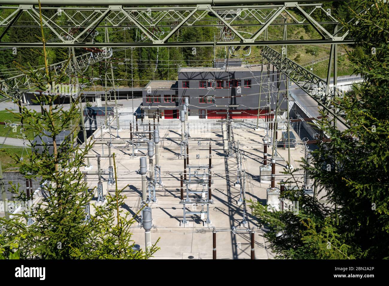 A horizontal view of an electrical power substation in the remote valleys of the Swiss Alps Stock Photo