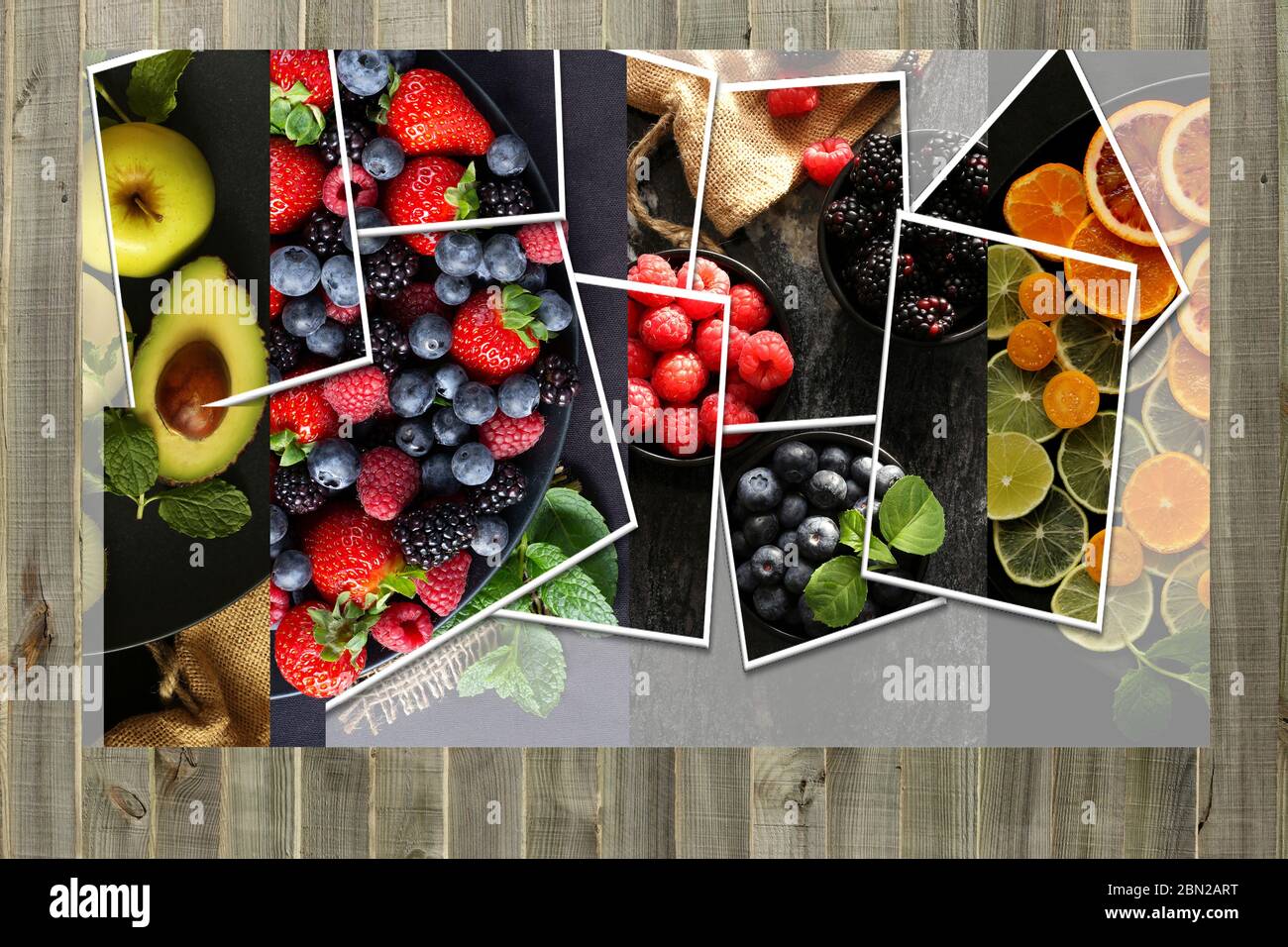 Collage of summer fruits and berries on wooden background. Healthy, vegetarian food concept. Mock up Stock Photo