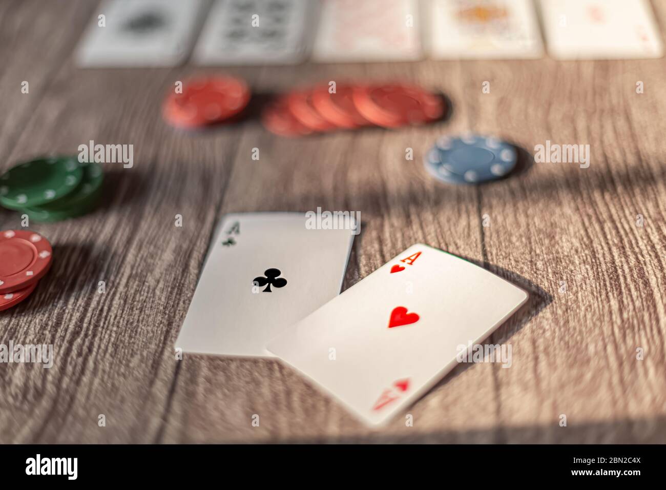 Poker theme wood table with cards and chips Stock Photo Alamy