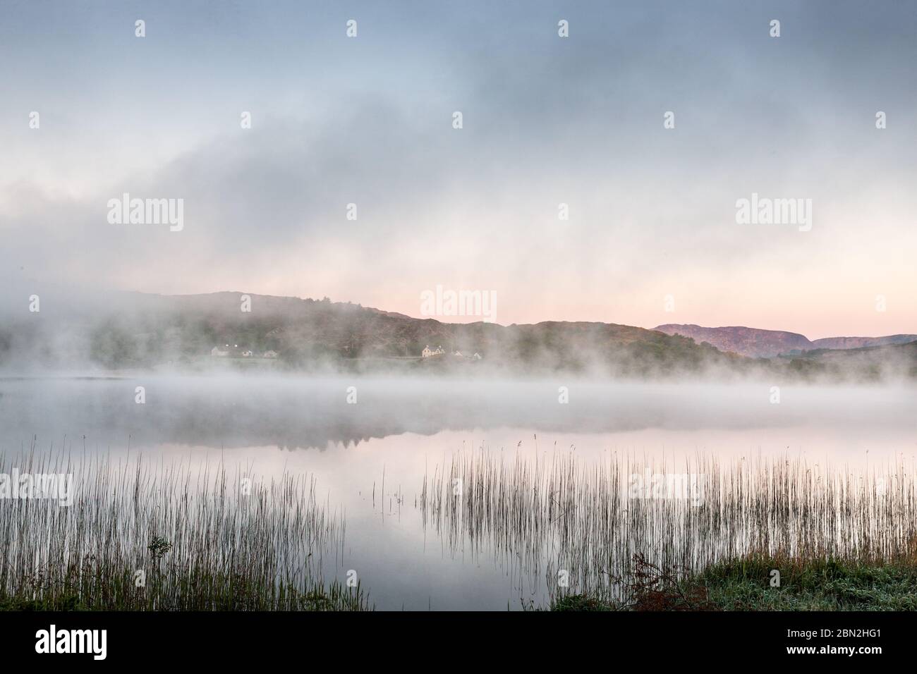 Ballingeary, Cork, Ireland. 12th May, 2020. Early morning fog and mist rising from the rising sun at Lough Aulla in Ballingeary, Co. Cork, Ireland. - Credit; David Creedon / Alamy Live News Stock Photo