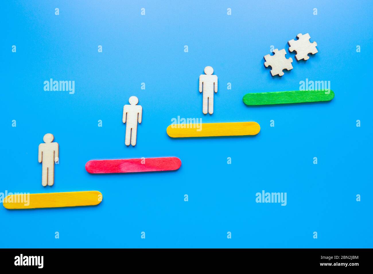 Business image of wooden ladder with people icons over blue table ...