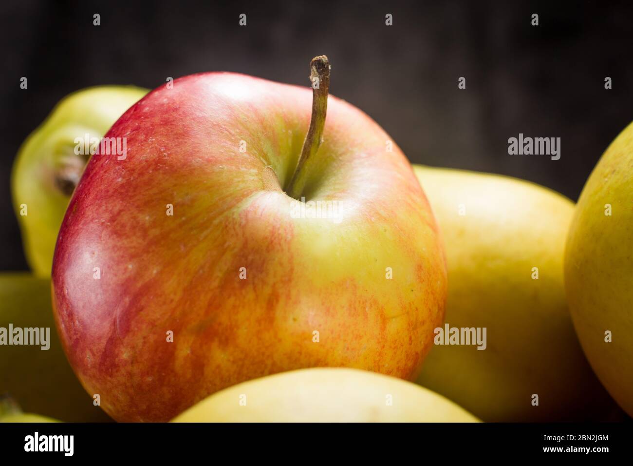 apples and pears on a dark background Stock Photo