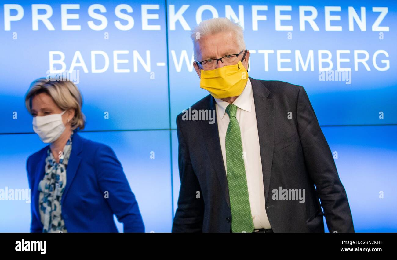 Stuttgart, Germany. 12th May, 2020. Winfried Kretschmann (r, Bündnis 90/Die Grünen), Prime Minister of Baden-Württemberg, followed by Baden-Württemberg's Minister of Economics Nicole Hoffmeister-Kraut (CDU), goes to a government press conference. At the press conference, the state government announced new aid for medium-sized businesses. Credit: Christoph Schmidt/dpa/Alamy Live News Stock Photo