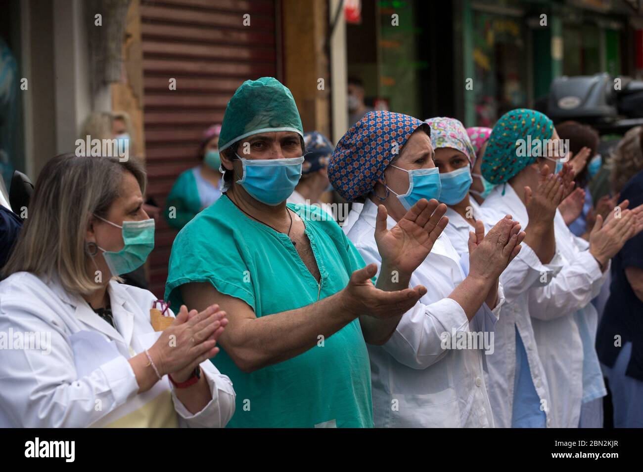 Athens, Greece. 12th May, 2020. Nurses wearing face masks applaud at
