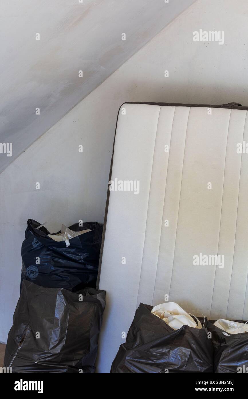 Garbage bags with remains of wallpaper Stock Photo - Alamy