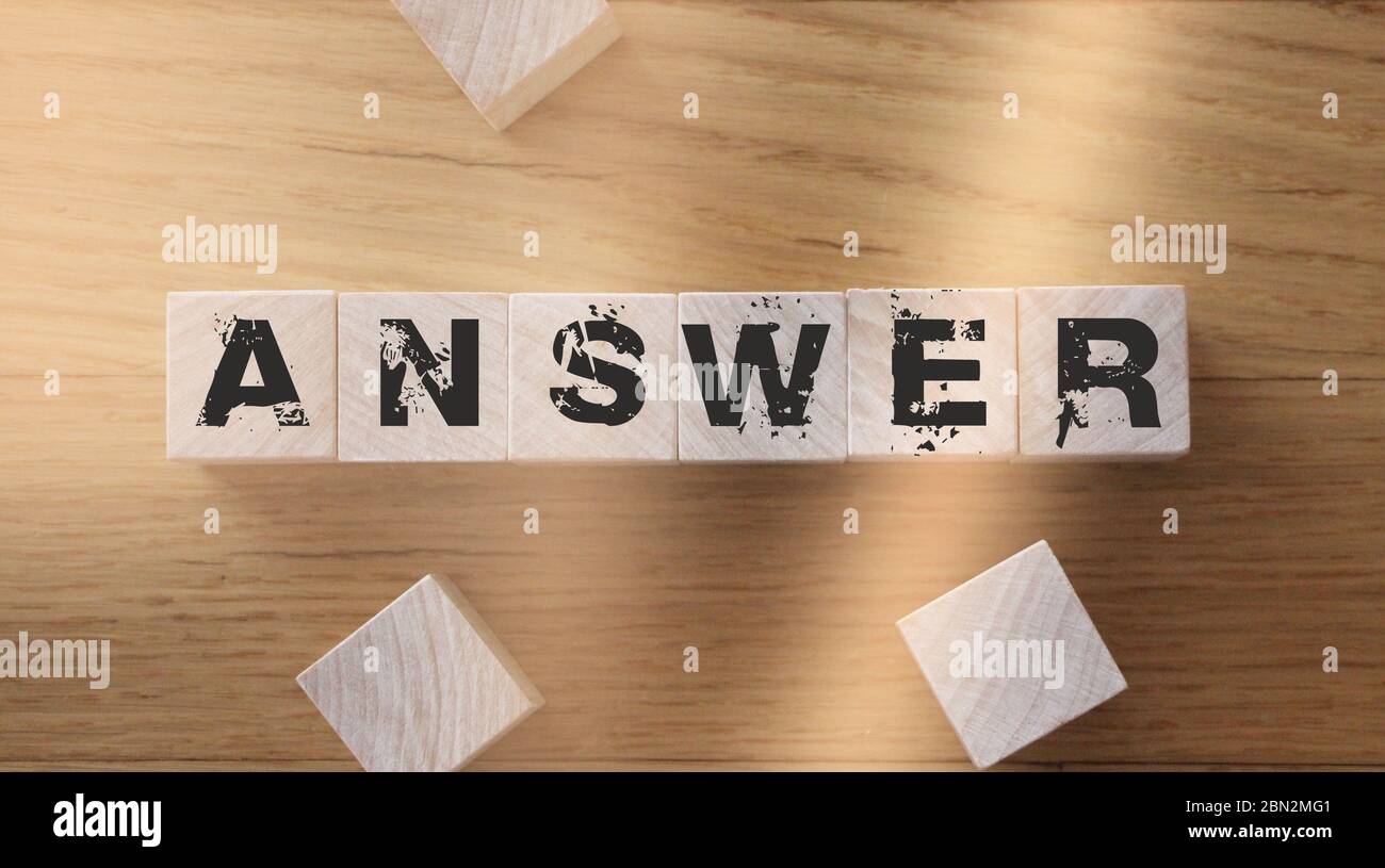 Wooden Blocks with the text: Answers. Questions and answers support desk Expert consulting business concept Stock Photo