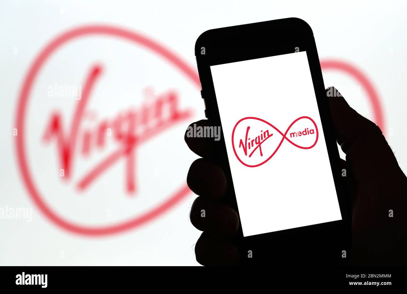 Virgin Media mobile phone network logo on a mobile phone (Editorial use  only Stock Photo - Alamy