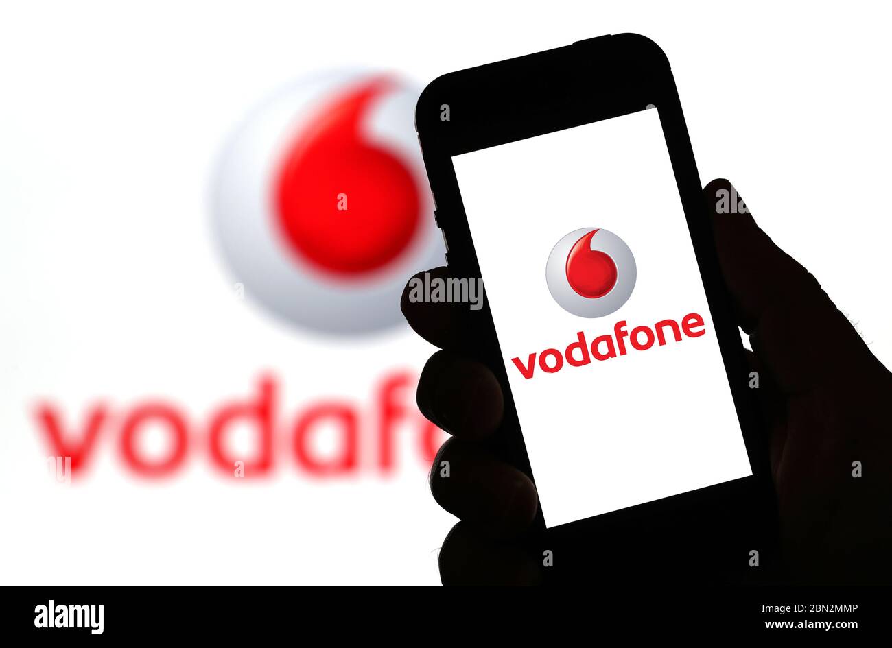 Vodafone mobile phone network logo on a mobile phone (Editorial use only) Stock Photo