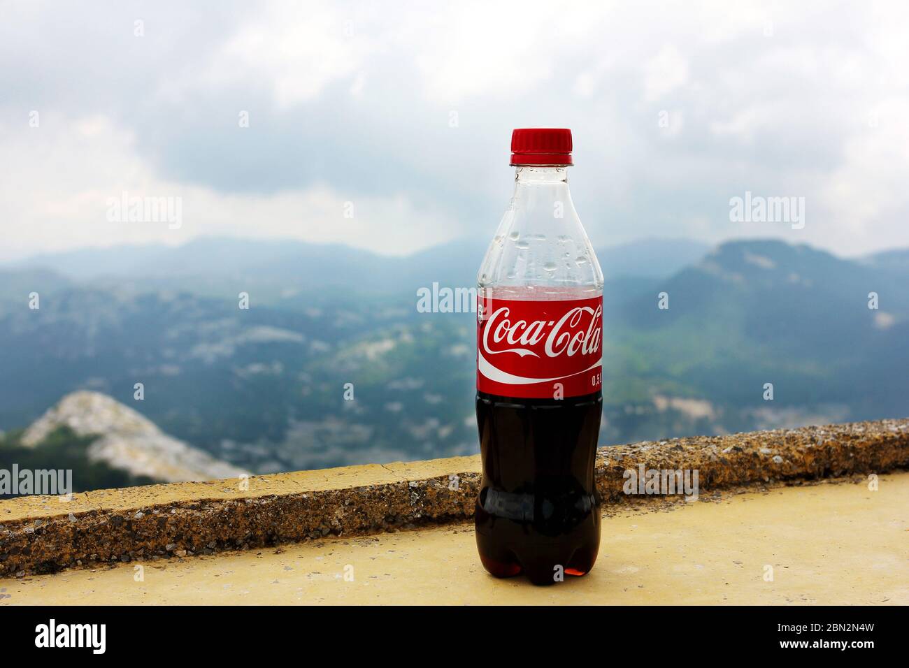 Færøerne venstre Bær LOVCHEN, MONTENEGRO - July 16, 2012: Plastic bottle of Coca-Cola drink  against nature background with mountains. Refreshment with Coca-Cola  concept Stock Photo - Alamy