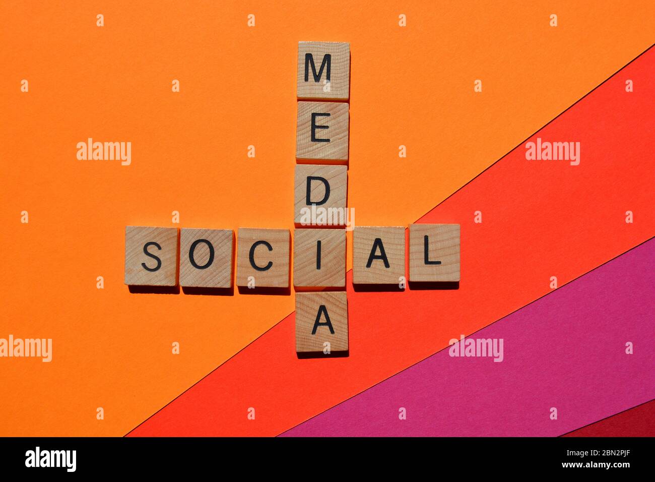Social Media, crossword on bright coloured background Stock Photo